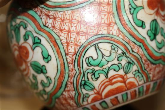A pair of 19th century Chinese enamelled porcelain jars with wood covers and stands height 25cm